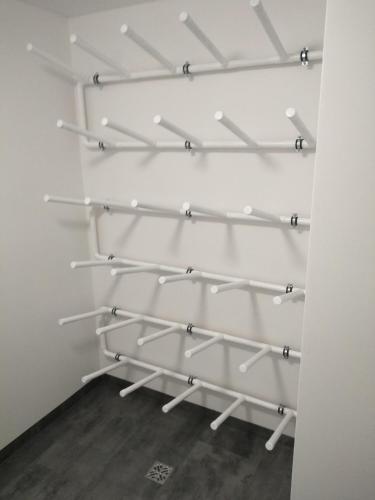 a room with white shelves on the wall at Pokoje Na Szlaku in Lądek-Zdrój