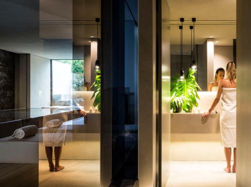 a bride and groom in a bathroom in a hotel at Zash Country Boutique hotel & SPA in Giarre