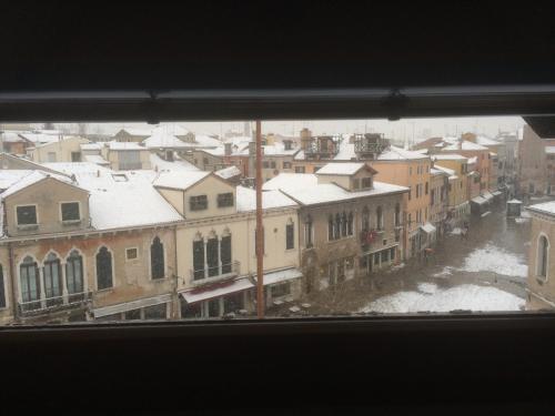 a view of a city in the snow from a window at Cà Sardi in Venice