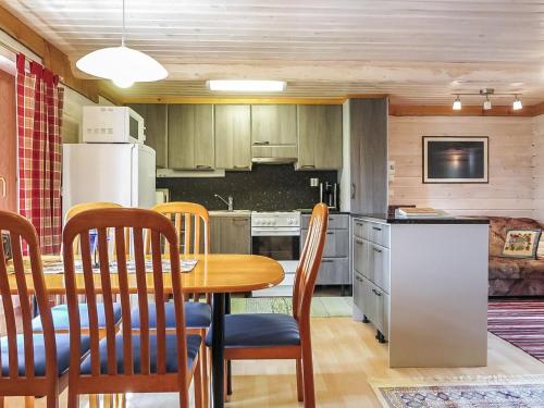 a kitchen with a table and chairs in a room at Holiday Home Ruska by Interhome in Kyrö