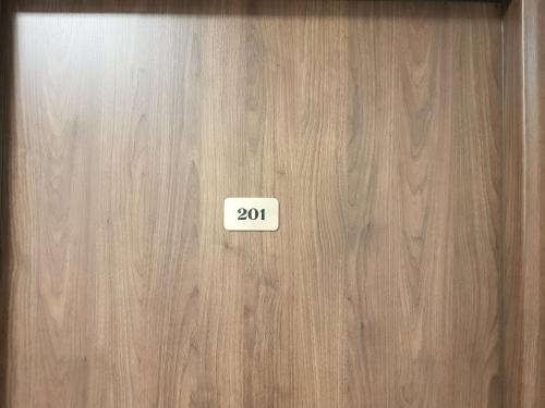 a wooden door with the number on it at Centrum Promocji Leśnictwa w Mucznem in Lutowiska