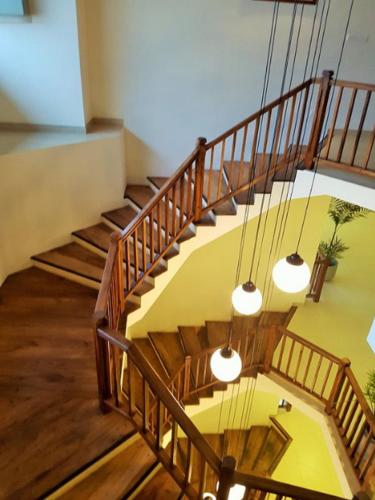 a set of stairs in a building with lights at Twenty-Two Weligambay in Weligama