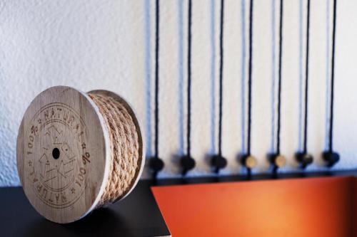 a wooden object sitting on top of a table at ibis Styles Toulouse Lavaur in Lavaur