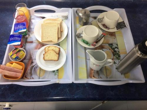 an open refrigerator with food on a table at Hostal Residencia Blest Gana in Viña del Mar