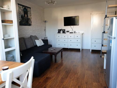 a living room with a couch and a tv at Apartment IVANA in Novalja