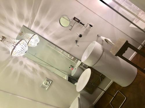 a bathroom with a toilet and a mirror at Luxury My home in Tolentino