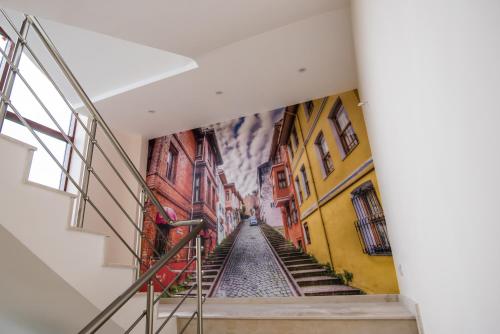 a hallway with a mural of a street in a building at SPA Kompleks Raiski Kat in Dimitrovgrad