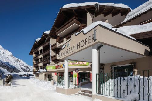a hotel in the snow with a sign that reads knights hotel at Hotel Andreas Hofer in Sankt Leonhard im Pitztal