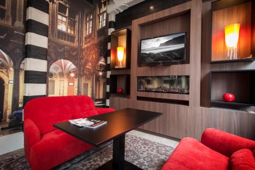 Télévision ou salle de divertissement dans l'établissement Mercure Lille Centre Grand Place