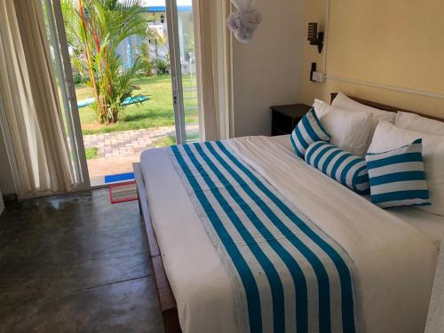 Cama o camas de una habitación en Ocean Caves, Balapitiya