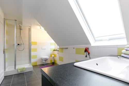 a bathroom with a large tub and a shower at Ferienwohnung Franke in Heilbad Heiligenstadt