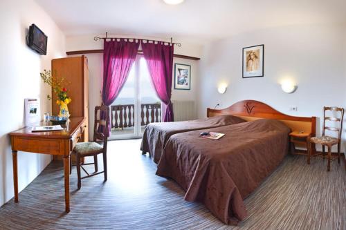 Postel nebo postele na pokoji v ubytování Auberge Obersolberg