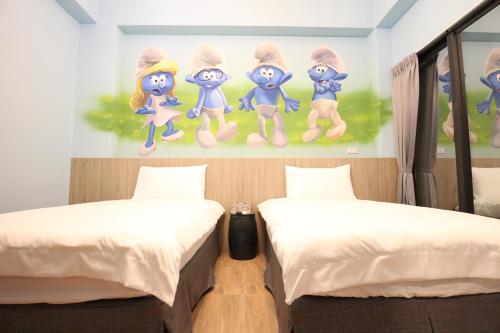 Cama o camas de una habitación en 蘑菇城堡民宿