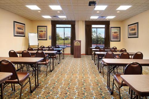a classroom with tables and chairs in a room at Wingate by Wyndham New Braunfels in New Braunfels