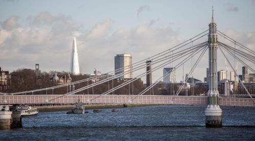 a bridge over water with a city in the background at Absolute Clapham in London