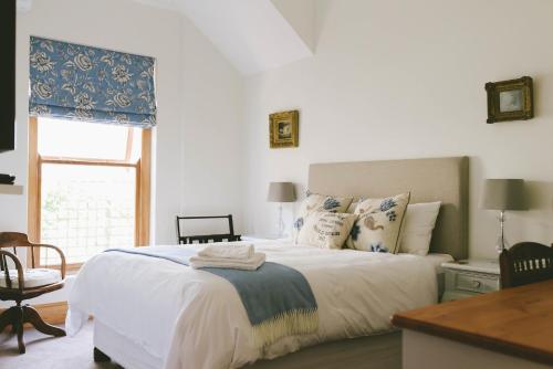 Postel nebo postele na pokoji v ubytování The Victorian Goose