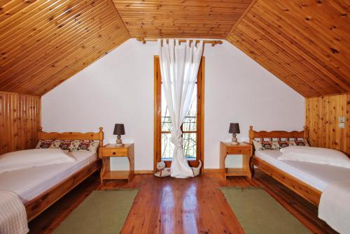 A bed or beds in a room at La Nonna Efrosini