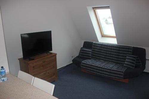 Μια τηλεόραση ή/και κέντρο ψυχαγωγίας στο Apartamenty Twoje Mikołajki