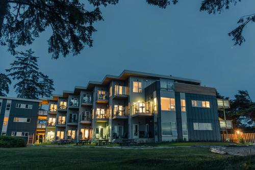 an exterior view of a building at night at Pacific Sands Beach Resort in Tofino