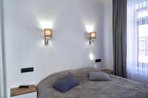 a bedroom with a bed with two pillows on it at Villa Gor in Bukovel