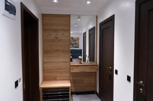 a bathroom with a sink and a wooden wall at Villa Gor in Bukovel