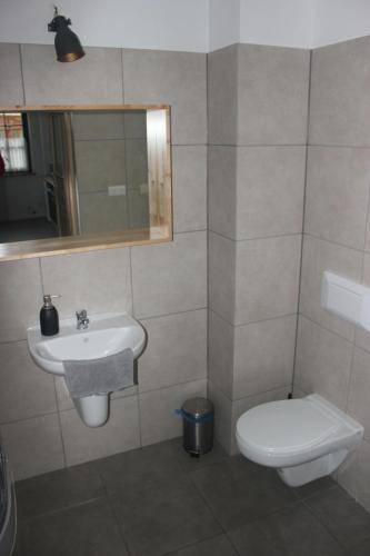 Ένα μπάνιο στο Apartamenty Twoje Mikołajki