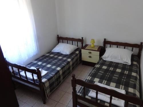 Postel nebo postele na pokoji v ubytování Apartments Palma