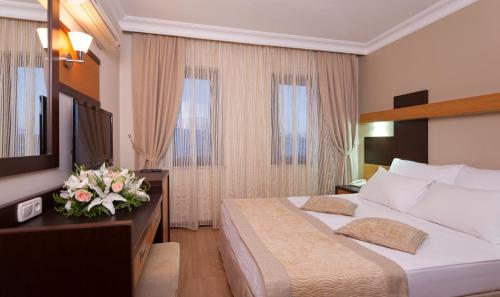 Voodi või voodid majutusasutuse Kandelor Hotel toas