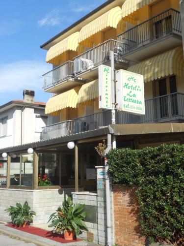 a building with a sign in front of it at Hotel Ristorante La Terrazza in Lido di Camaiore