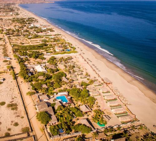 an aerial view of a beach with a resort at Vichayito Bungalows & Carpas by Aranwa Hotels in Vichayito
