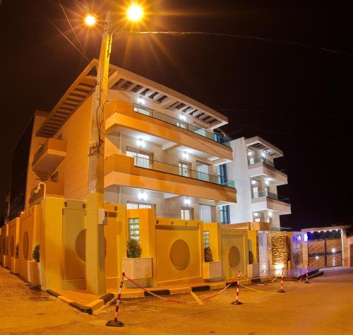 a building with a street light in front of it at RESIDENCE TOURISTIQUE DU PORT in Alger
