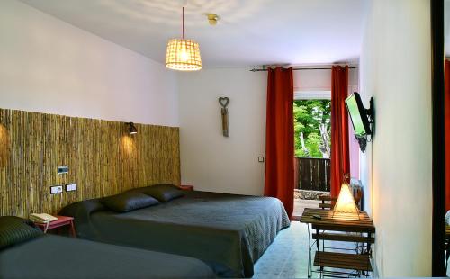Postel nebo postele na pokoji v ubytování Hotel Rio Piedra
