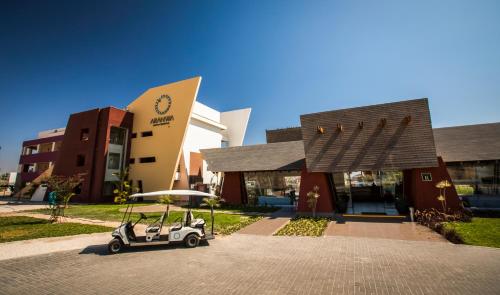 a small golf cart parked in front of a building at Aranwa Paracas Resort & Spa in Paracas