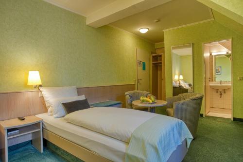 Кровать или кровати в номере Hotel Kischers Landhaus