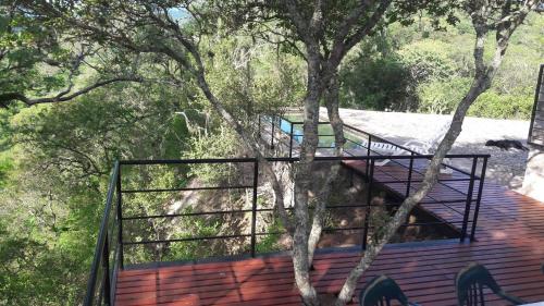 a deck on top of a house with trees at LA AGÜITA PERDIDA in Raco