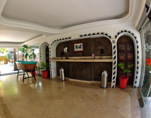 a living room with a table and a pool table at Hotel Rio Malecon in Puerto Vallarta