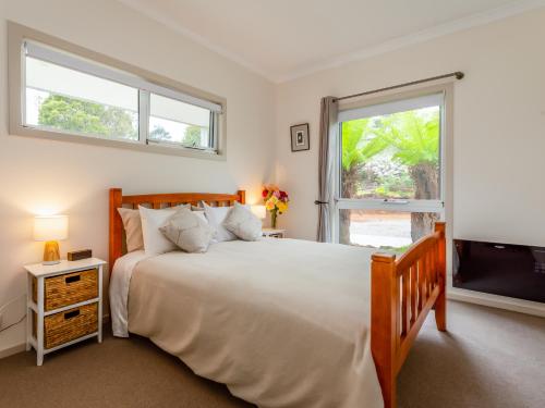 a bedroom with a large bed and a television at Erriba House in Erriba