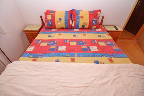a pair of beds in a small bedroom at Vila As in Zlatibor