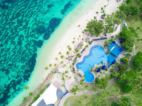 an aerial view of the beach and the ocean at Shangri-La Yanuca Island, Fiji in Voua