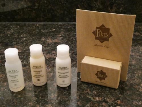 three bottles of moisturizers sitting next to a box at Pike's Waterfront Lodge in Fairbanks