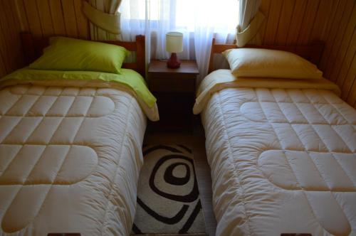 Ένα ή περισσότερα κρεβάτια σε δωμάτιο στο Cabanas Manzanal