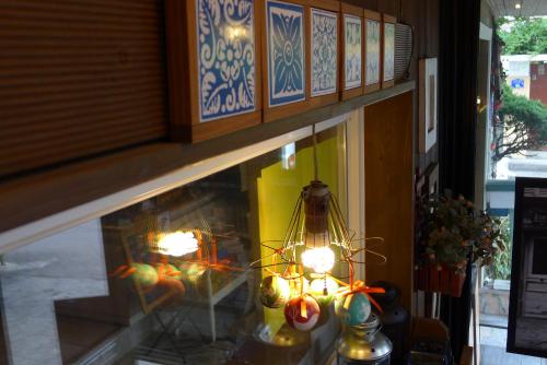 a display window of a store with lights in it at The House Hostel in Sokcho