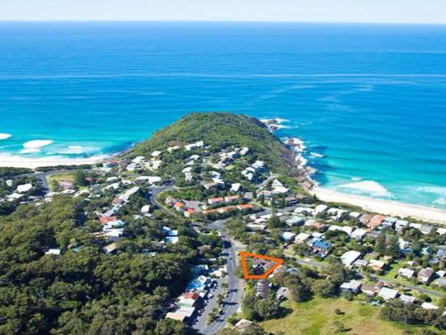 an aerial view of a mountain next to the ocean at Aqua Apartment 3 in Blueys Beach