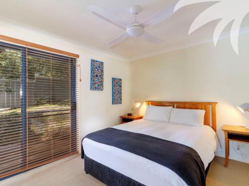 Una cama o camas en una habitación de Lilys