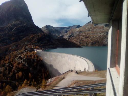 a view of the hoover dam in the mountains at Appartment Emosson 2 in Finhaut