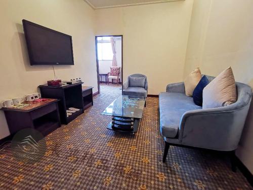 TV a/nebo společenská místnost v ubytování Chang Hong Hotel