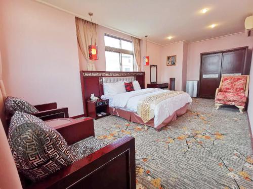 Postel nebo postele na pokoji v ubytování Chang Hong Hotel