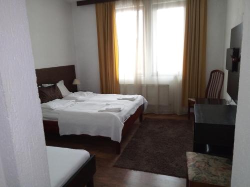 Postel nebo postele na pokoji v ubytování Guest house Elit
