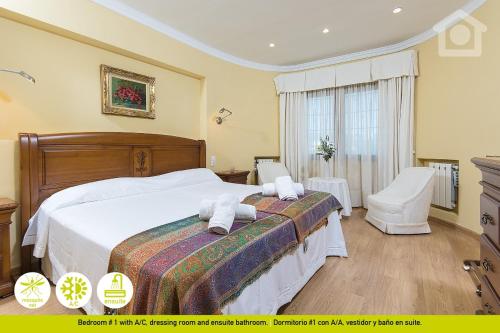 a bedroom with a bed with two towels on it at Sol Habitat Villa La Sort in Moraira
