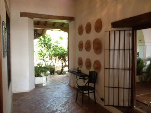 a hallway of a house with a table and chairs at Portal de la Marquesa in Mompos
